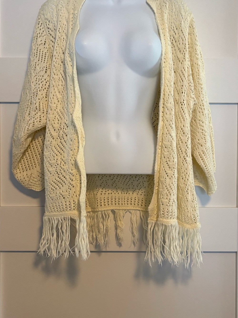 Open-Weave Fringe Knit Shrug in Cream